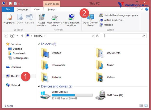 mở File Explorer và chọn mục This PC ở bên trái. Sau đó, mở tab Computer từ menu ribbon ở đầu cửa sổ và nhấp vào nút Open Control Panel.